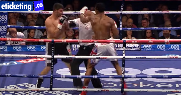 Joshua is hitting the punch to the Refree